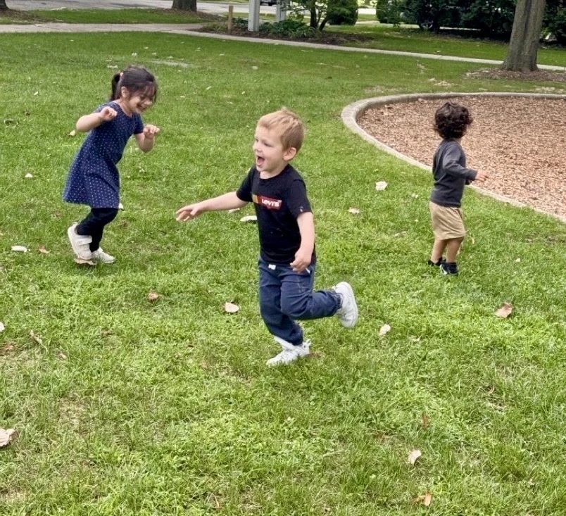 Children playing outdoors at a Little Muslims center